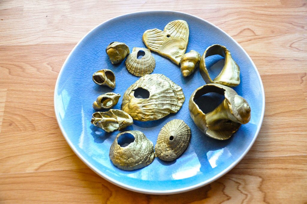 homemade Christmas tree ornaments using shells and gold spray paint